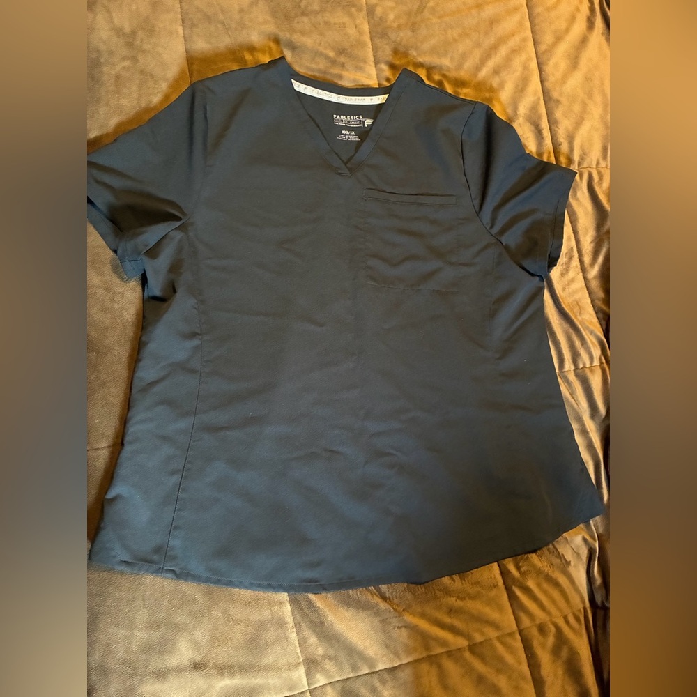 Fabletics brand, size XXL/1X, black scrub top with one top pocket.